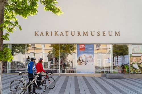 Karikaturmuseum Krems with a Cyclist