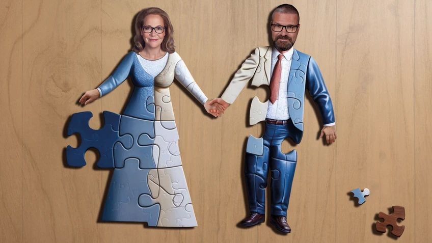Das Foto eines Paares, das einander an der Hand hält als Puzzle auf Holz