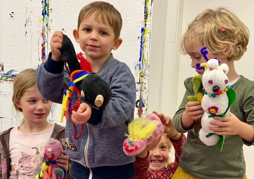 Kids with dolls made out of socks