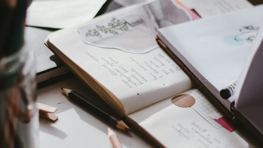 Open note books and pens.