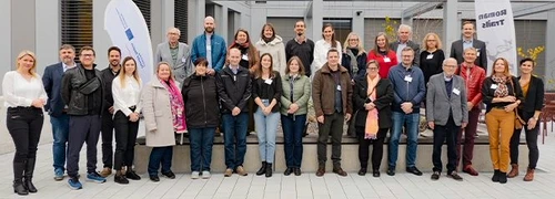 Group photo of the experts from the Roman Legacy Project, with the people standing together as a group 