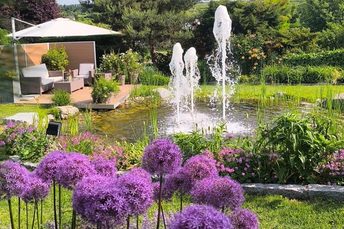 Garden view with pond and flowers at Kittenberger Erlebnisgärten