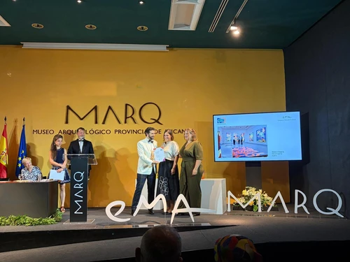 Award recipients on stage during an award ceremony.