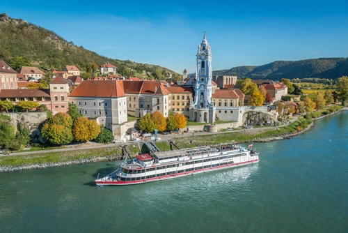 Bird's-eye view of Dürnstein with the Danube and a ship in the foreground