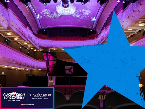 Theatersaal in violettem Licht, großer blauer Stern über das Bild gelegt, links unten das Logo des Eurovision Song Contest