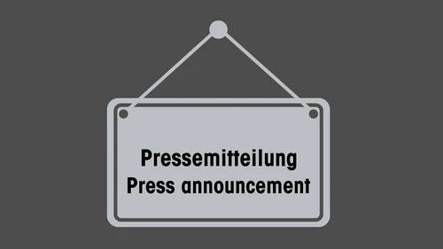Schild in grau wo Pressemitteilung zu lesen ist