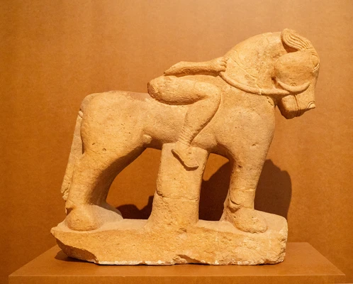 Equestrian statue in the Iberian exhibition at Mamuz; a horse and a headless rider carved from light-colored stone