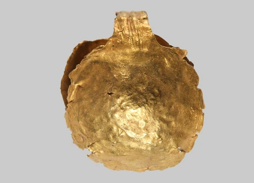 A Roman Bulla, Two embossed hemispherical shells of an amulet capsule, connected by a ribbed, band-shaped suspension loop. The serrated edge of one half is preserved only as a remnant.